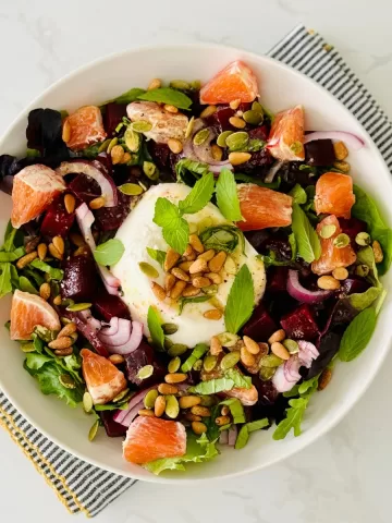 Beets and Burrata Salad with Pine Nuts and Springs Mix