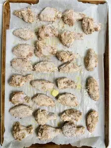 Raw Chicken Wings on a Baking Sheet